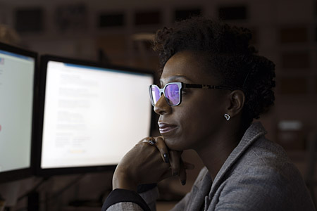 Misc - Woman with glasses looking at desktop